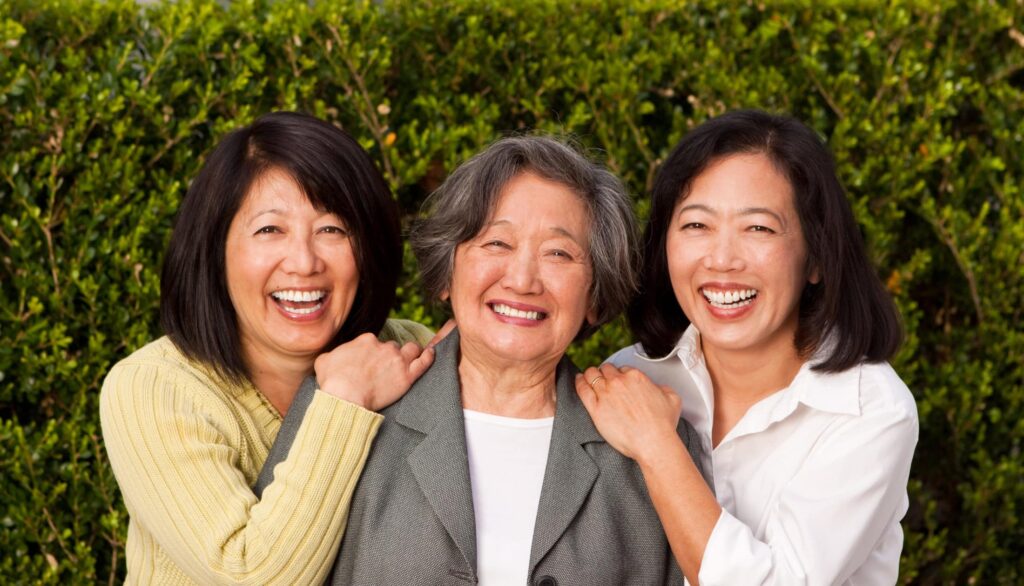 Happy mature mother and her adult daughters.