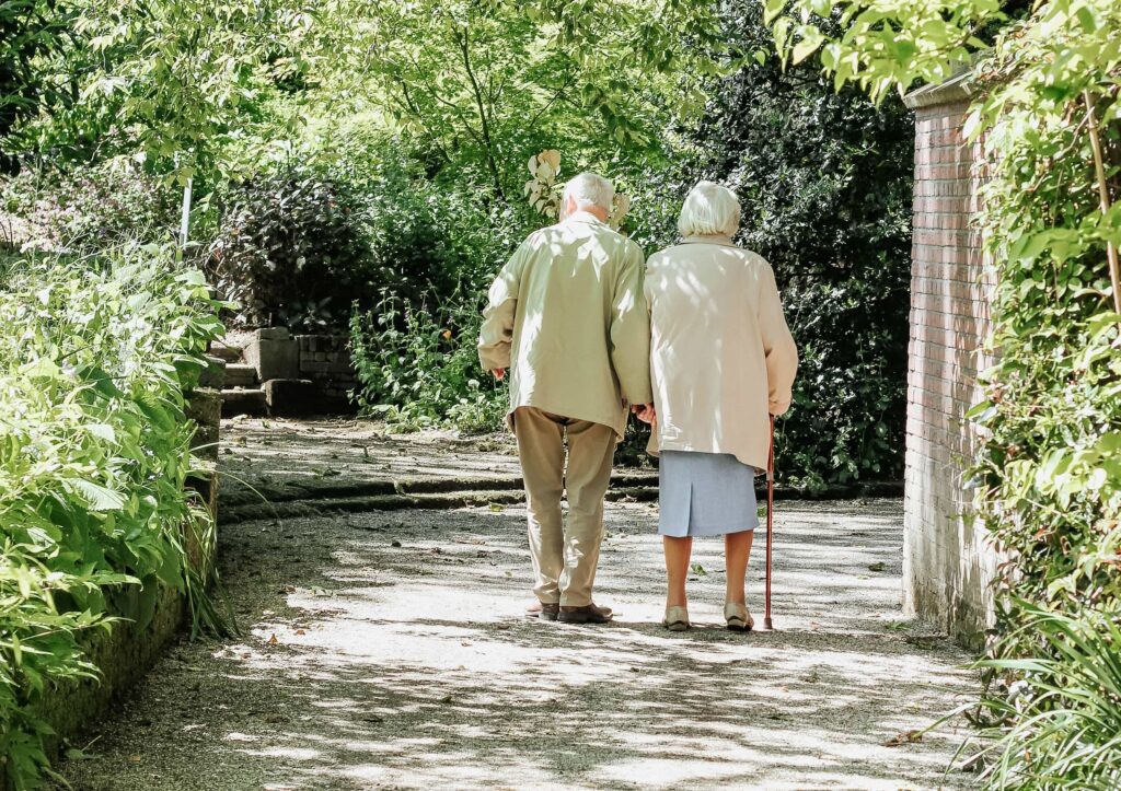 elderly couple walking together