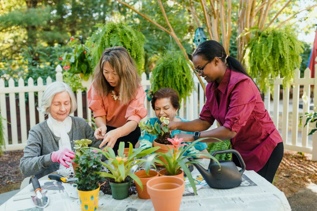 residents gardening with care team