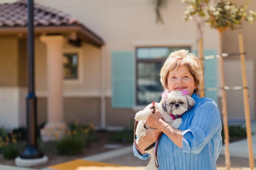 resident with small dog