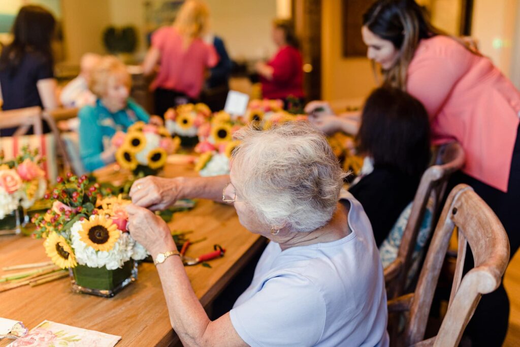 residents making floral arrangements