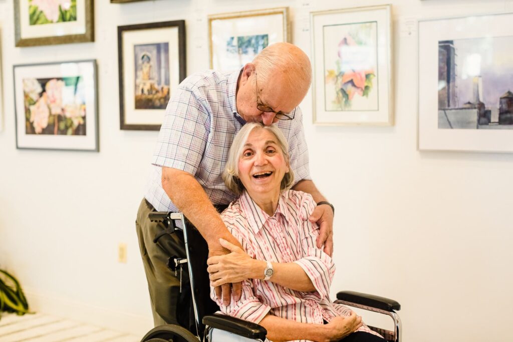 elderly couple enjoying art gallery