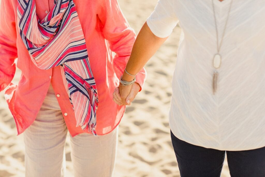 two women holding hands