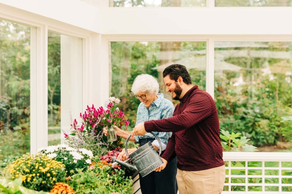 Resident gardening with staff