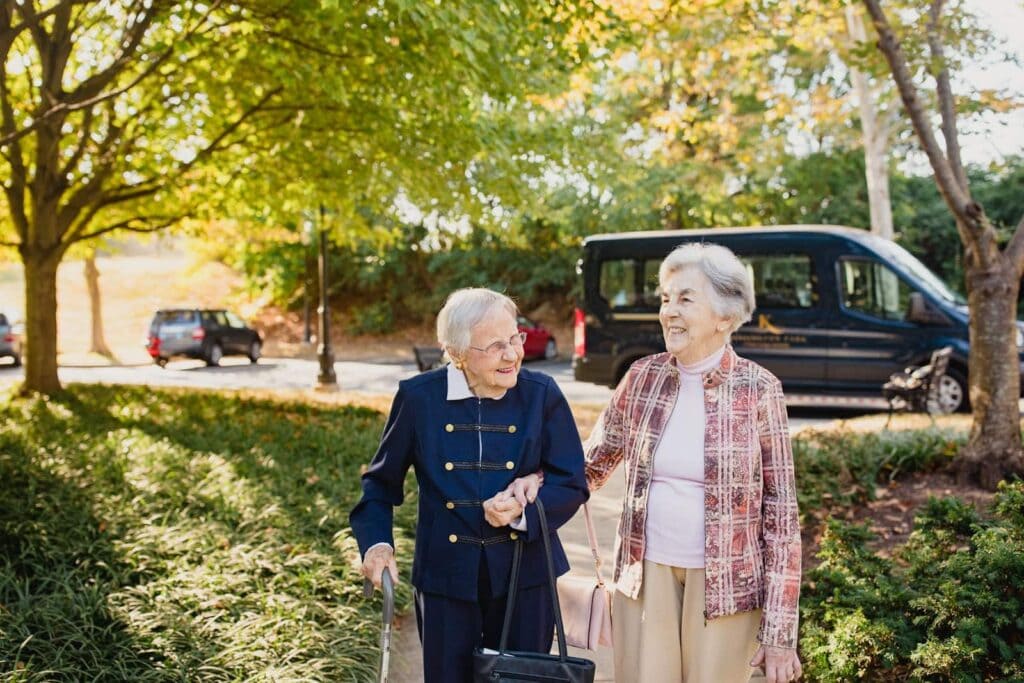 two residents walking together