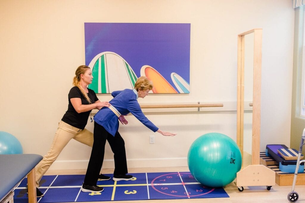 resident and therapist doing exercises