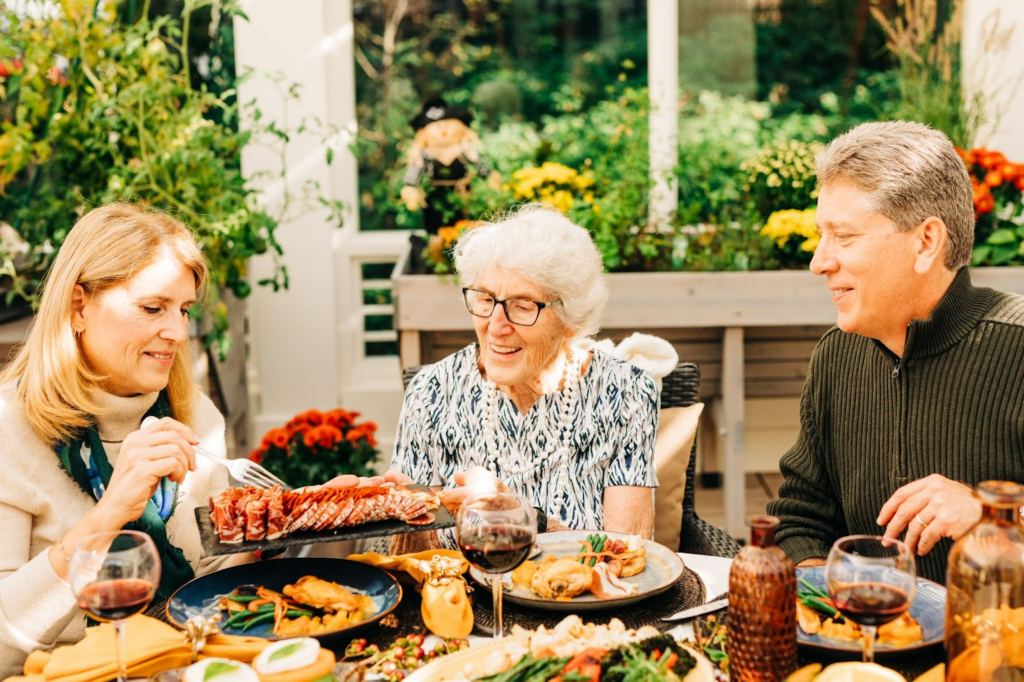 resident and family enjoying meal together