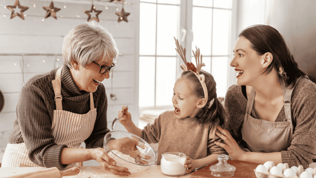 woman, child, and elderly woman baking together