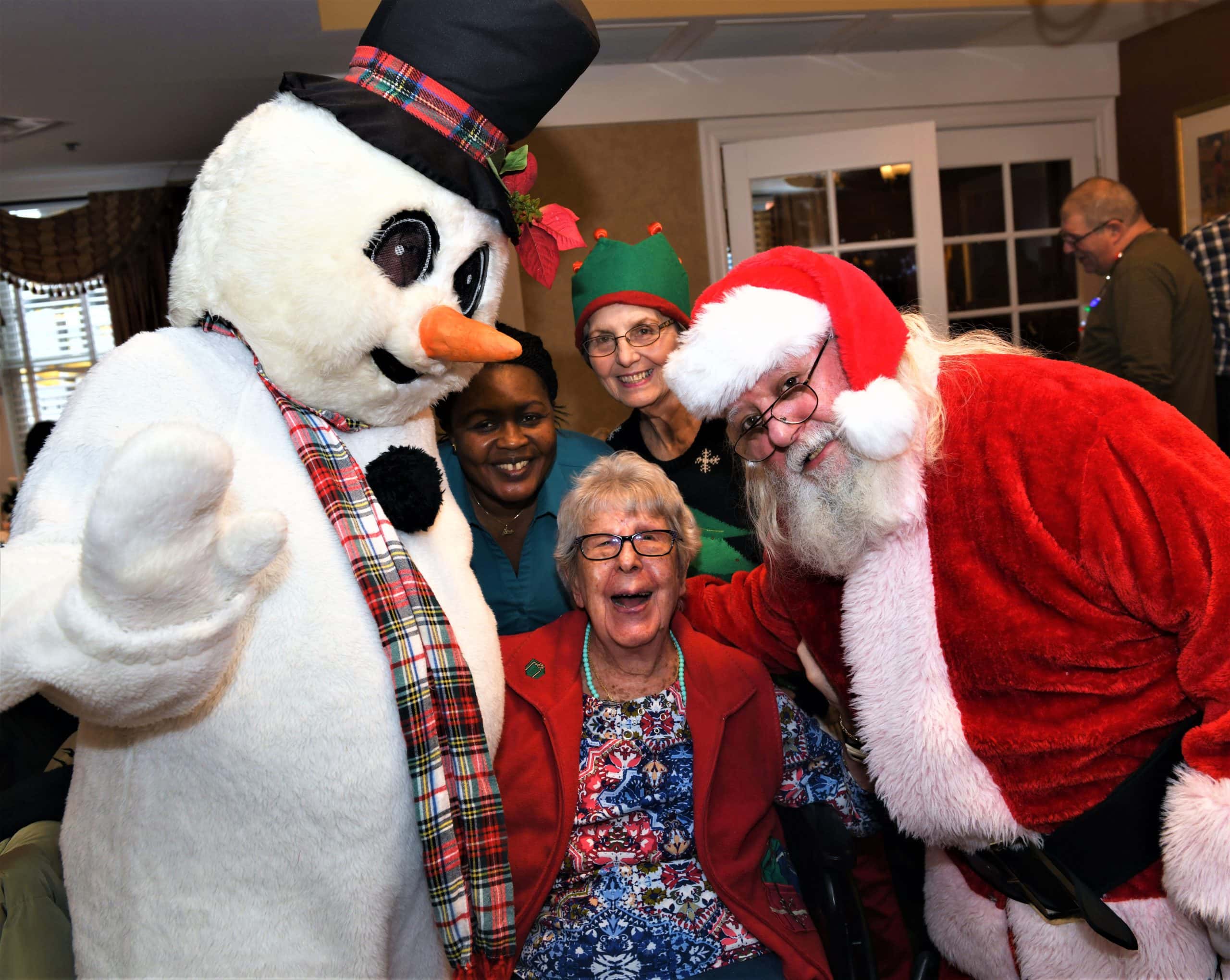 santa and snowman visiting residents
