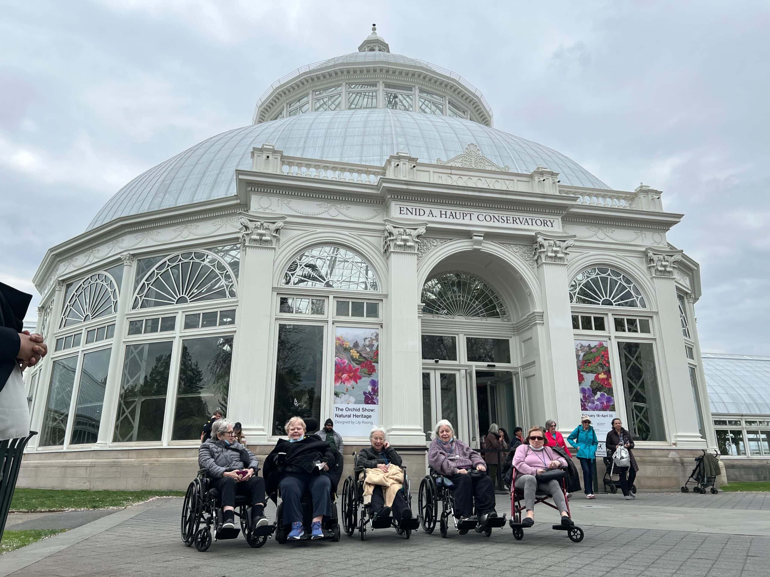 residents in front of conservatory