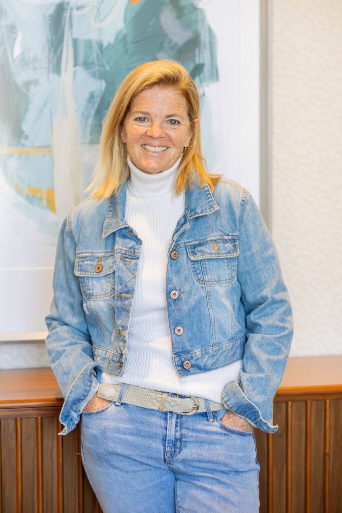photo of woman in jean jacket