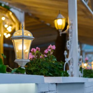 decorative street lamps decorating a summer terrace with forged elements