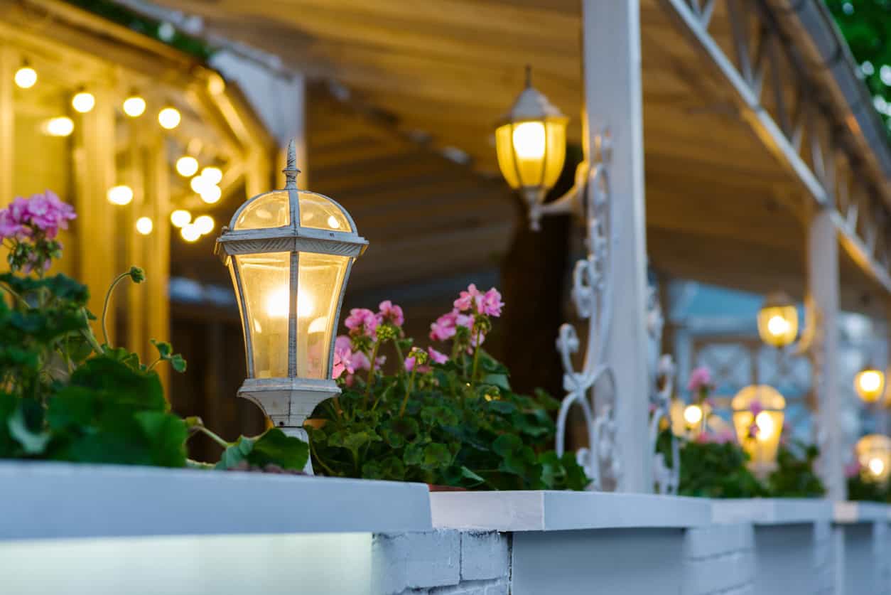 decorative street lamps decorating a summer terrace with forged elements