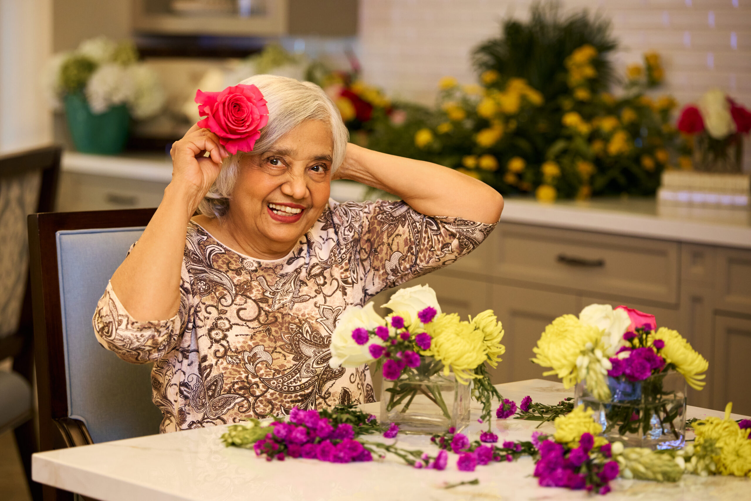 Senior lady doing flower arrangements