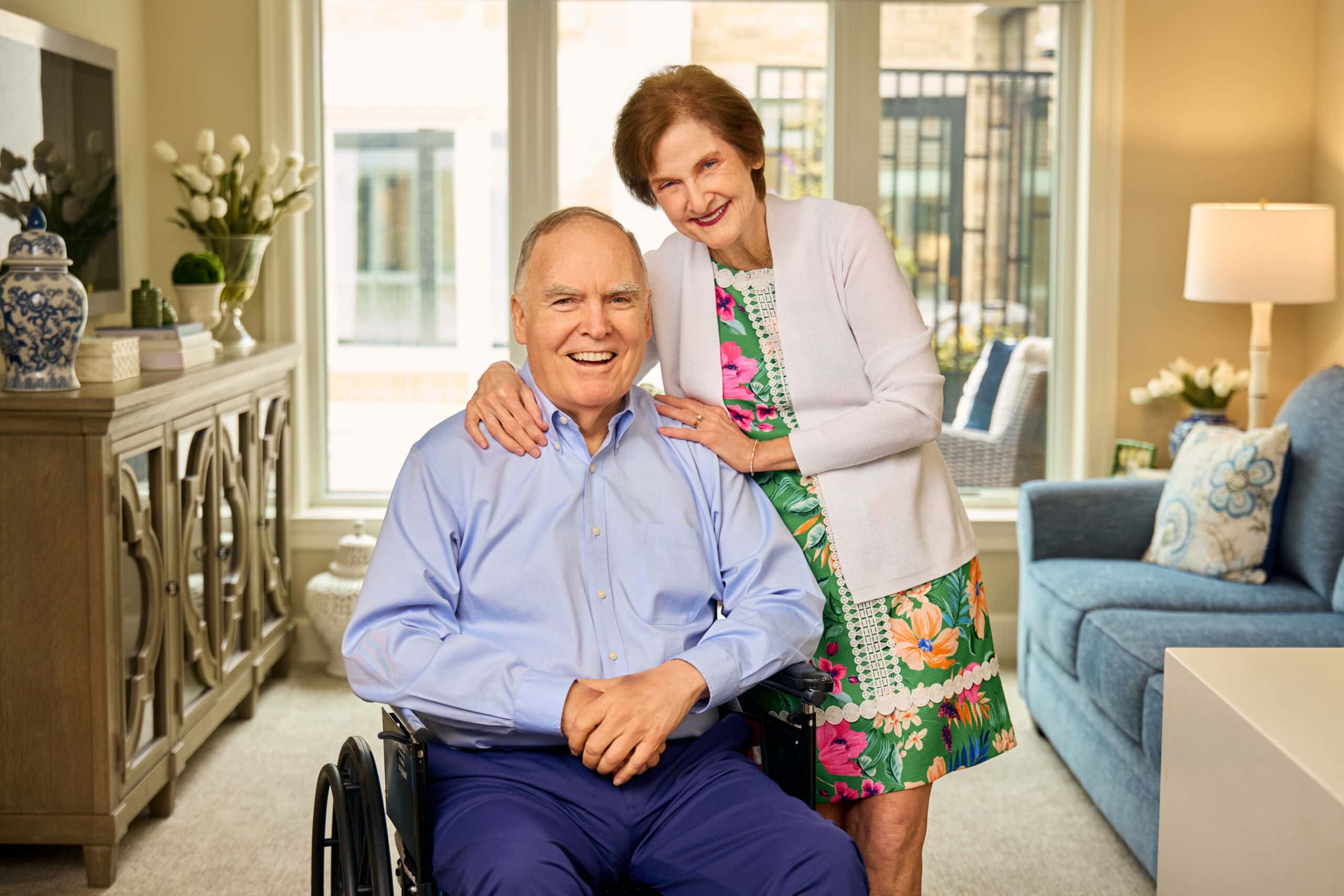 older gentleman on a wheelchair and his wife