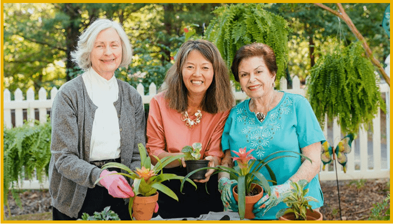 women in the garden smiling