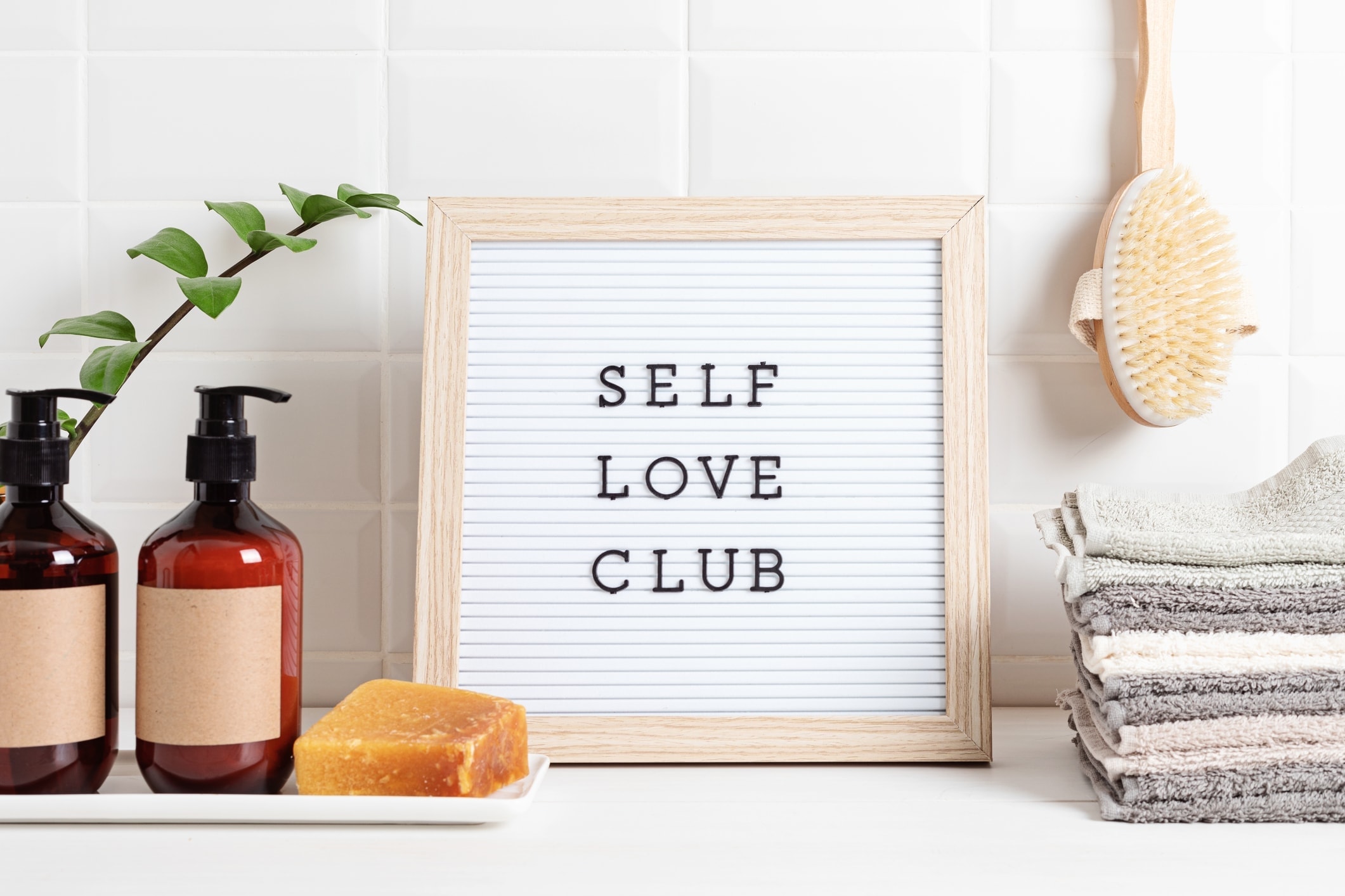 Bathroom sign with self love club on it