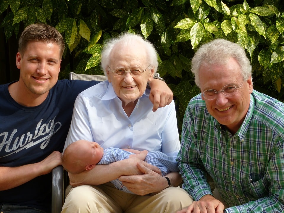 Four Generations of Men on Father's Day holding a baby.