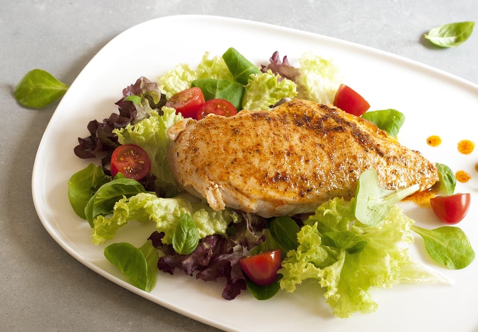 chicken breast over salad