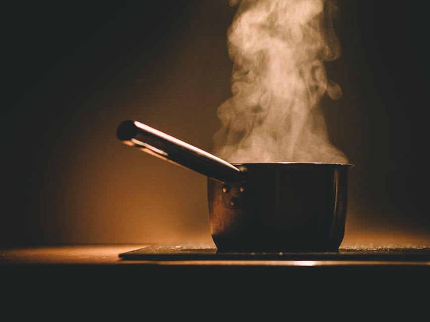 saucepan boiling water with noodles