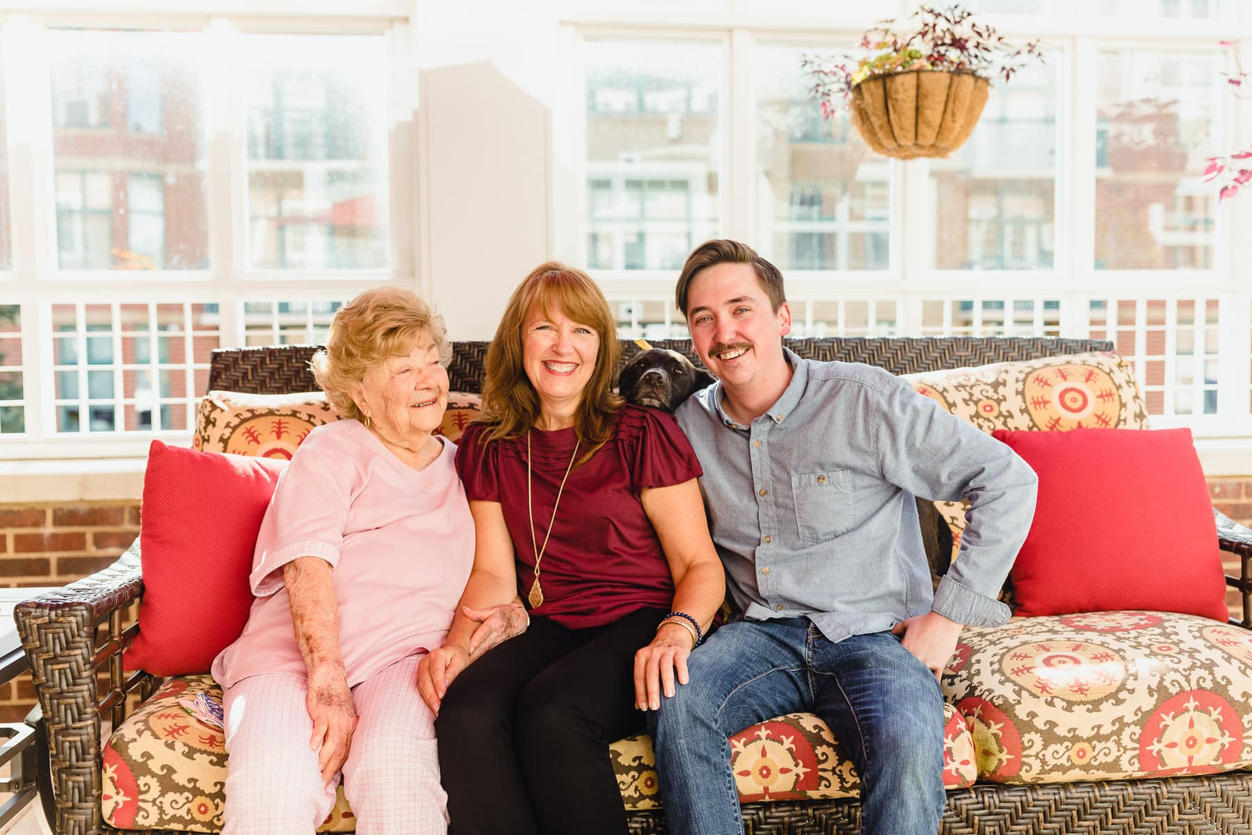 residents with family sitting on couch