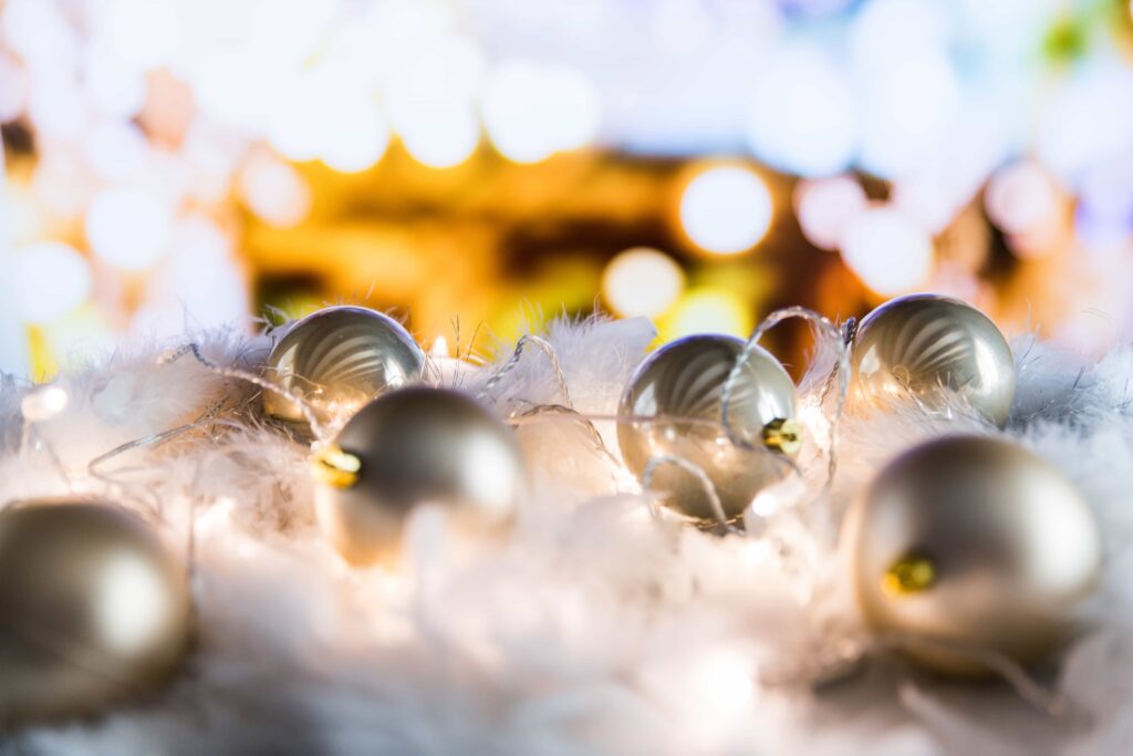 closeup of ornaments and Christmas lights