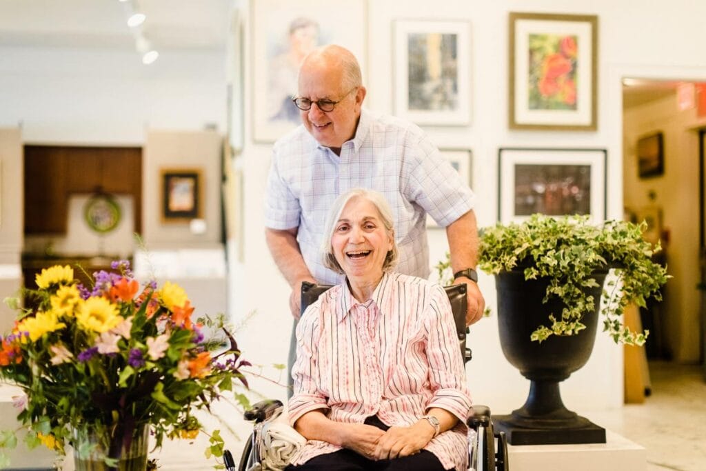 elderly couple enjoying art gallery