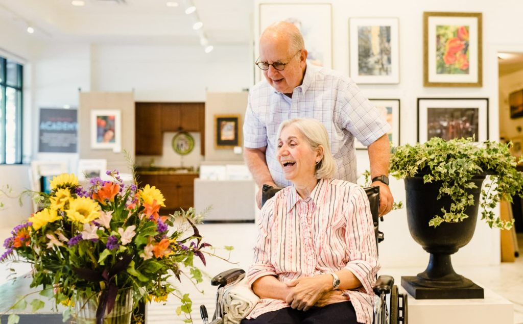 elderly couple enjoying art gallery