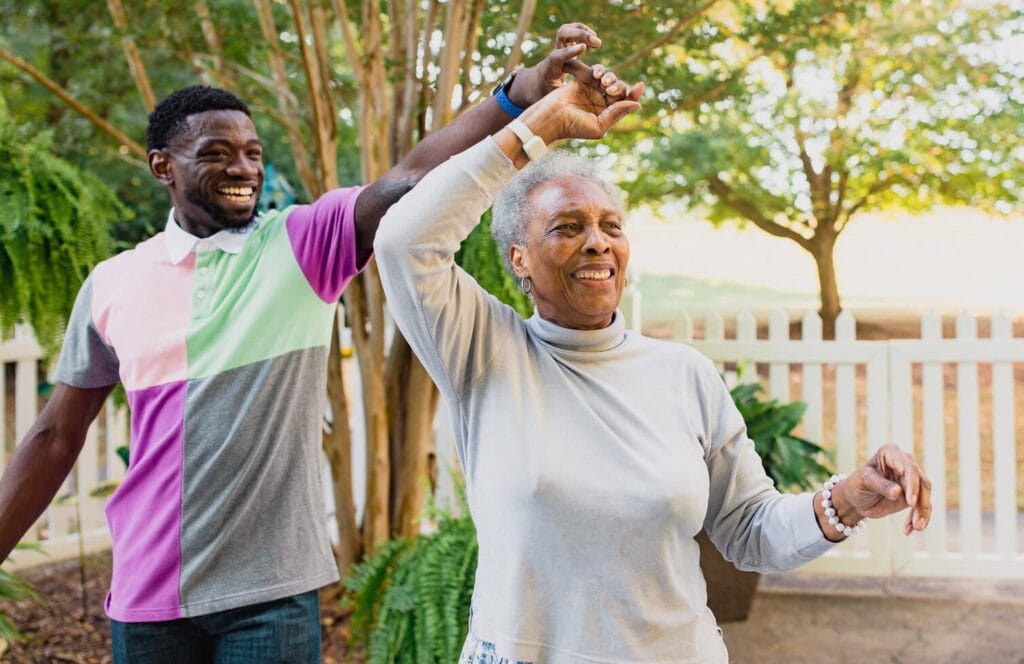 resident and family member dancing