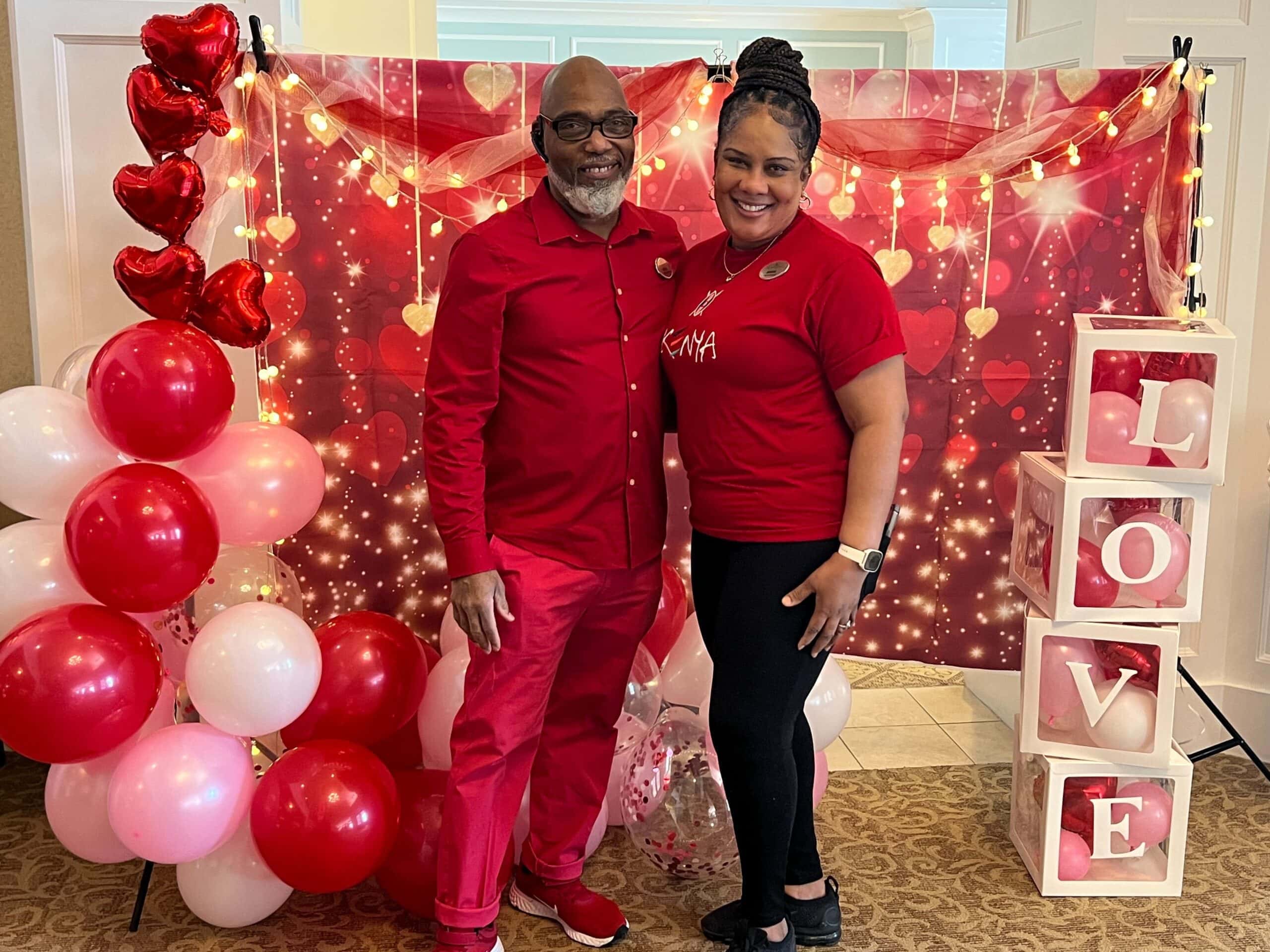 team members posing for photo during Valentine's Day party