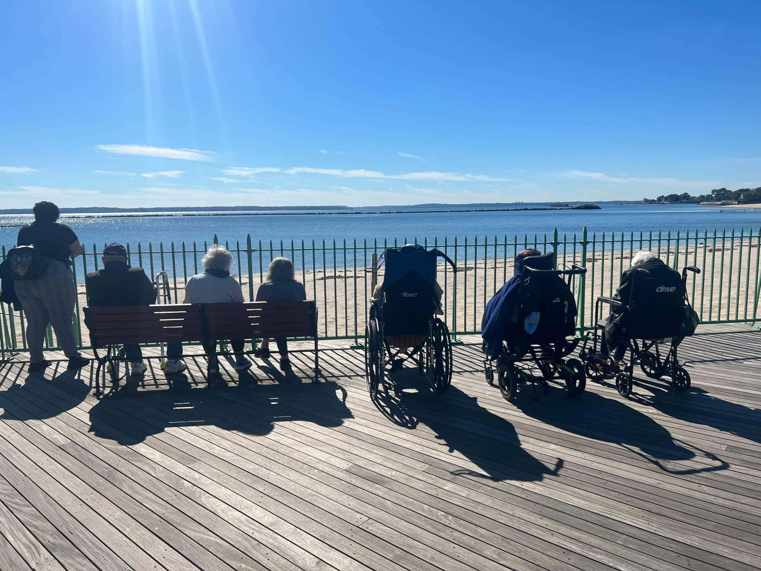 residents sitting and viewing the beach