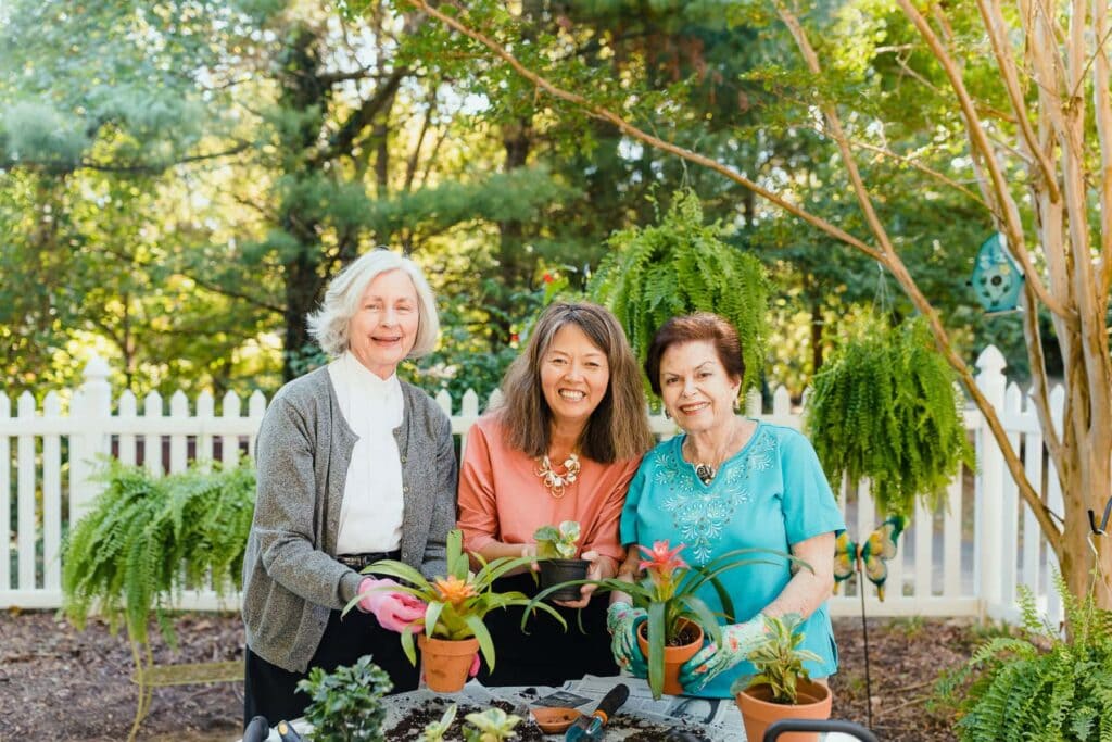 residents and team member gardening