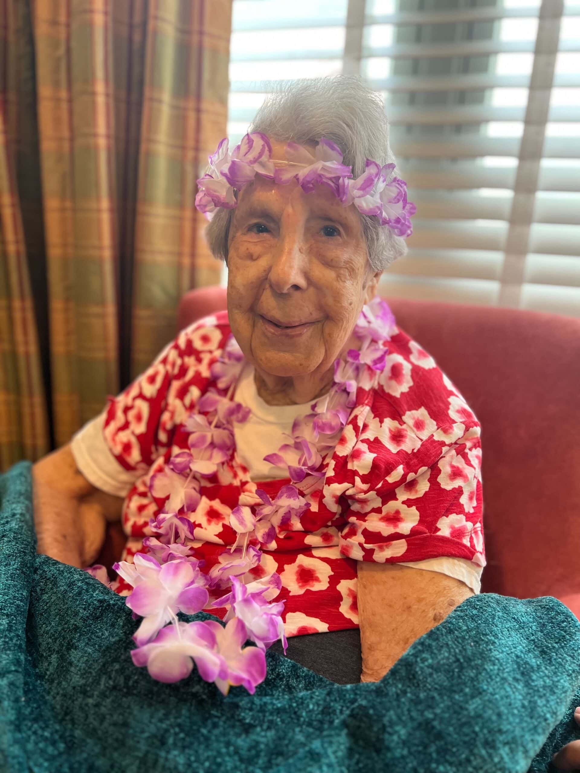 resident in Hawaiian shirt and flower lei