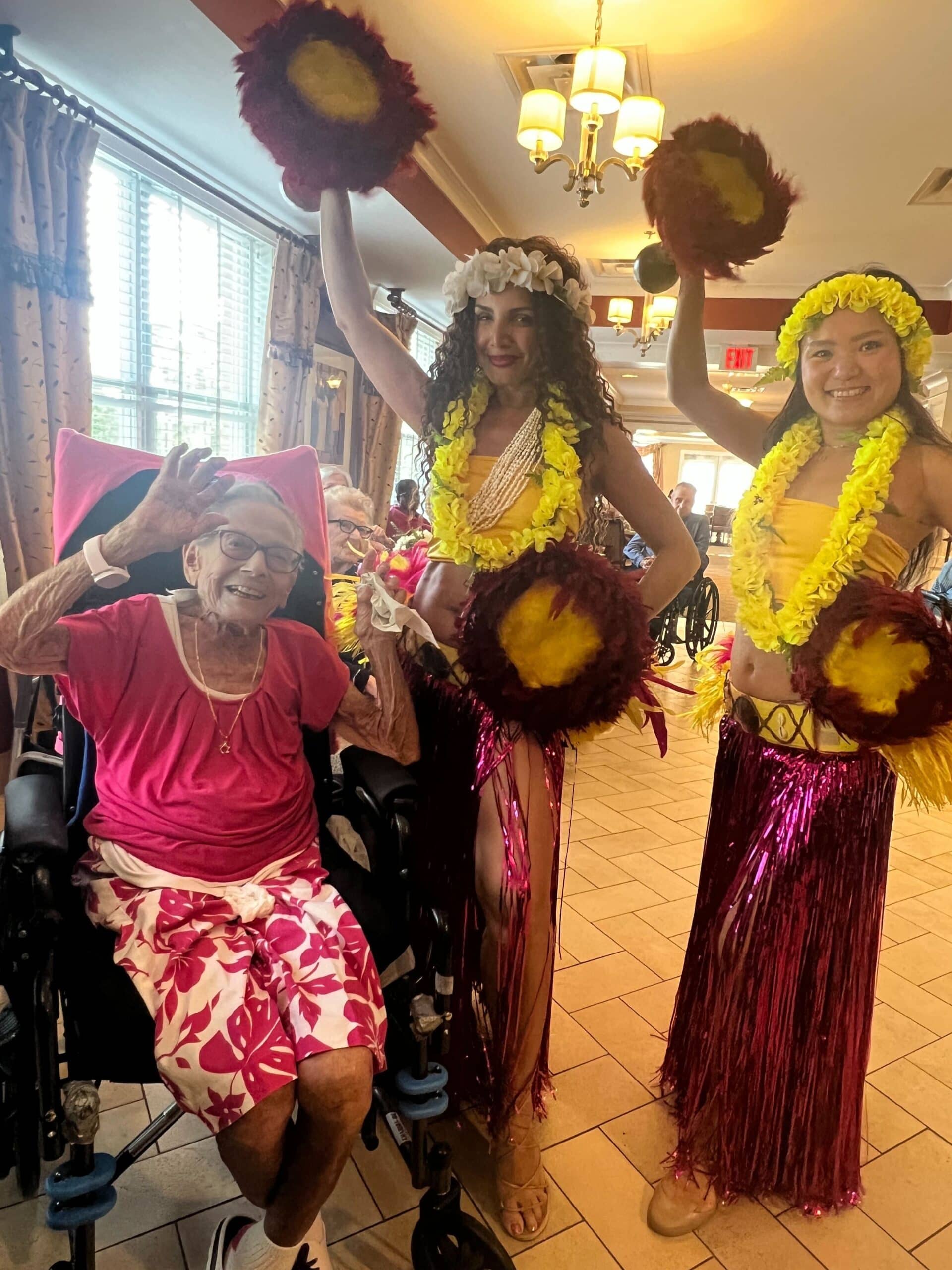 resident with 2 hula dancers