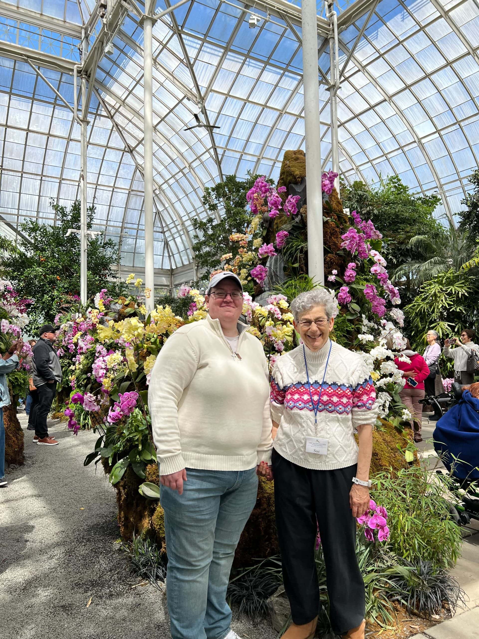 staff and resident in conservatory